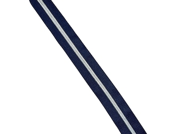 May include: A navy blue zipper with a silver-colored coil. The zipper is angled across the frame against a white background. This sewing notion is suitable for various apparel and craft projects.