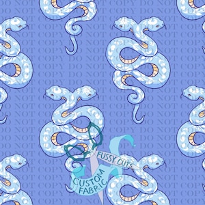 May include: A repeating pattern on a light blue background featuring two-headed snakes in shades of light blue and white with floral accents. The text DO NOT COPY is repeated across the image, and a logo reads FUSSY CUTS CUSTOM FABRIC.