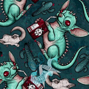 May include: A teal and pink creature drinks from a carton labeled "GOAT'S BLOOD" in a repeating pattern. The design includes cacti, skulls, and the text "FUSSY CUTS CUSTOM FABRIC" on a teal background.