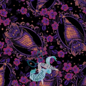 May include: A black fabric featuring a repeating pattern of purple and orange bats wrapped in cocoons, each framed by ornate oval borders. The design includes clusters of purple flowers and small stars, with a watermark reading FUSSY CUTS CUSTOM FABRIC.