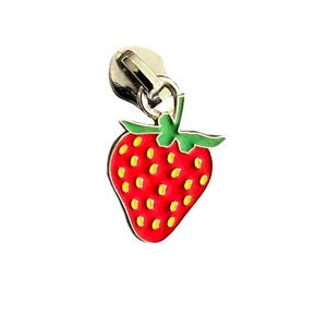 May include: A red strawberry zipper pull with yellow seeds and green leaves. The zipper pull is attached to a silver-colored metal clasp. The strawberry design is a bright, cheerful accent for clothing or accessories.