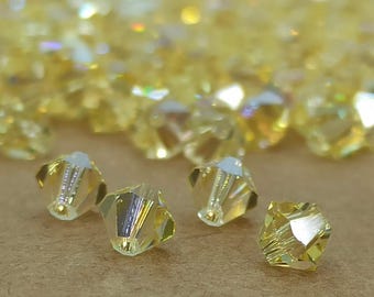 Cuentas bicono de cristal Swarovski Jonquil AB (5 mm)