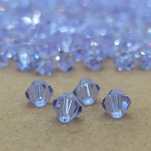 Swarovski alexandrietkristal biconekralen, paarse alexandrietkralen, paars en blauw, alexandrietglas, lichtpaars kristal, alexandrietkralen