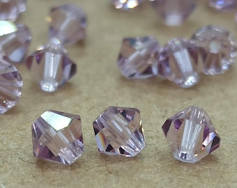 Swarovski licht-amethist kristal bicone kralen: 6 mm facetgeslepen paars