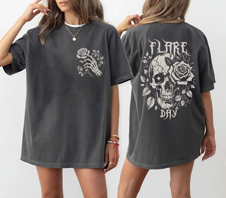 May include: A dark gray oversized t-shirt with a skull and rose graphic on the back and a skeleton hand holding a rose graphic on the front. The text "FLARE DAY" is printed below the skull graphic.