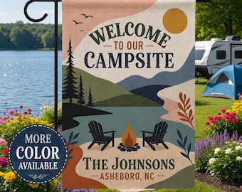 May include: A rectangular garden flag featuring a landscape illustration with a lake, mountains, pine trees, a campfire, and two chairs. The text reads WELCOME TO OUR CAMPSITE, THE JOHNSONS, and ASHEBORO, NC. A circular badge says MORE COLOR AVAILABLE.