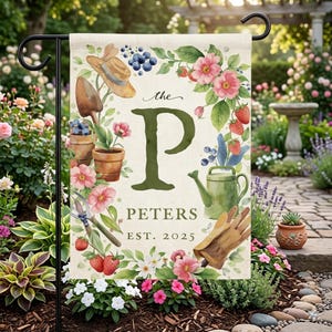 May include: A garden flag with a floral design, featuring a large green "P" and the name "Peters" with "EST. 2025". The flag includes illustrations of gardening tools, flowers, and berries, with a straw hat and watering can.