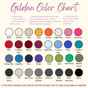 May include: A Gildan colour chart displaying a range of colours for clothing. The chart includes solid and heather colours, with details on fabric composition. The text at the top reads "Gildan Color Chart" in a cursive font.