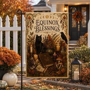 May include: A rectangular garden flag featuring the text Equinox Blessings, a black cat, a raven, a spellbook, candles, crystals, mushrooms, and autumn foliage. The design is framed by ornate botanical borders with moon phases at the top.