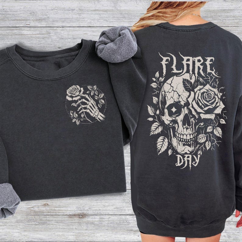 May include: Black sweatshirt with a skull and rose graphic on the back and a skeleton hand holding a rose on the front. The text "FLARE DAY" is printed below the skull.