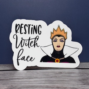 May include: White sticker with a black and white illustration of the Evil Queen from Snow White. The sticker says "Resting Witch Face" in black cursive text.