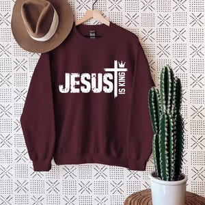 Jesus is King Shirt Jesus is King Tshirt Christian Merch Bible Verse Shirt Christian Streetwear Faith Based Apparel Religious Apparel GiftsJesus is King shirt
Christian streetwear shirt
Bible verse apparel
Faith based clothing
Religious gift for Christians
Christian merch tshirt
Jesus is King clothing