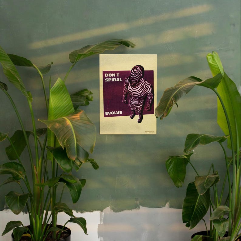 May include: A poster with the words "DON'T SPIRAL EVOLVE" and an illustration of a figure with a striped pattern. The figure is standing on a dark purple background. The poster is hanging on a green wall, with green plants in the foreground.