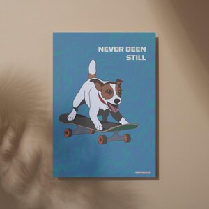May include: A poster featuring a Jack Russell Terrier on a skateboard. The dog is white and brown with a red collar. The poster has the text "NEVER BEEN STILL" in white letters on a blue background with a swirl pattern. The skateboard has orange wheels.