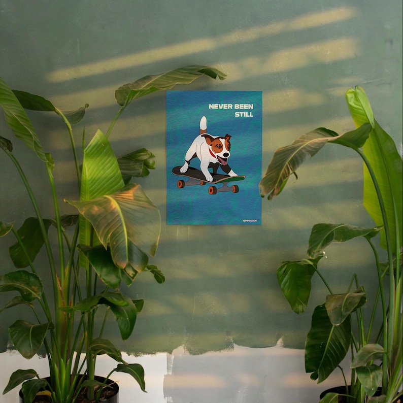 May include: A poster featuring a cartoon dog on a skateboard against a teal background. The dog is white and brown with a red collar. The poster reads "NEVER BEEN STILL" in white text.
