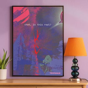 Abstract digital art print with blue, red, and magenta textures and the text “chat, is this real?”. Surreal internet-inspired wall art with a conceptual and ironic tone, perfect for Gen Z decor, creative rooms, or modern interiors. Artwork by Tempesque, hanged on a lilac wall next to a potted plant and a small orange lamp.