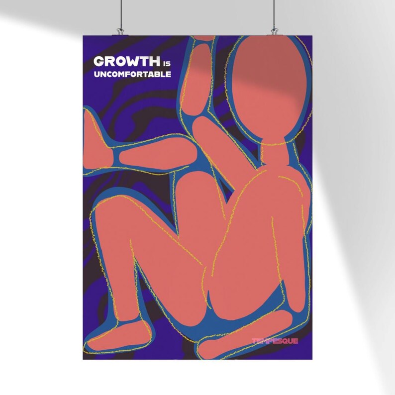 May include: A poster with the text "GROWTH IS UNCOMFORTABLE" in white letters. The artwork features a stylized, abstract human figure in coral against a deep blue background with swirling patterns. The figure is outlined in blue and yellow.