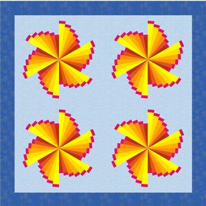 May include: A square quilt featuring a light blue background with a dark blue border. The quilt displays four identical pinwheel patterns arranged in a grid, each composed of radiating segments in shades of yellow, orange, and bright pink.