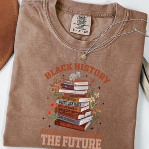 Black History Book Lovers Shirt lovers, this Comfort Colors tee is made for turning pages and honoring legacies, all in one easy, everyday look. This shirt  is not just a garment; it's a celebration of past triumphs and future aspirations.