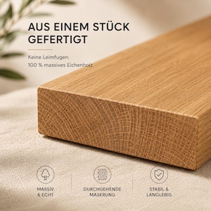 May include: A rectangular piece of solid oak wood with a visible grain pattern. The text reads: AUS EINEM ST&Uuml;CK GEFERTIGT, Keine Leimfugen, 100 % massives Eichenholz, MASSIV & ECHT, DURCHGEHENDE MASERUNG, STABIL & LANGLEBIG with three circular icons.