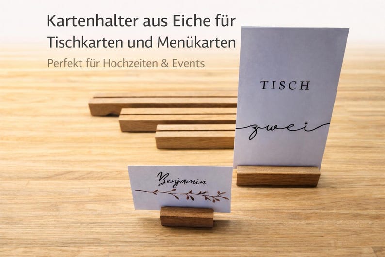 May include: Wooden table card holders with a natural finish. One holder displays a card with the word "TISCH zwei" in black script. Another displays a card with the name "Benjamin". The holders are designed for weddings and events.