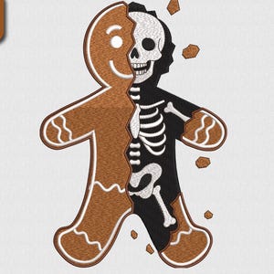 Peut inclure: Un motif de bonhomme en pain d'épices marron, divisé pour révéler un squelette noir. Le motif comprend le texte "5 SIZE" et des mesures de taille en cm: 9.6, 12.2, 14.7, 17.3, et 19.8. Le motif comprend également le texte "EXP DST JEF SEW ART PES VP3 SHV HUS XXX".