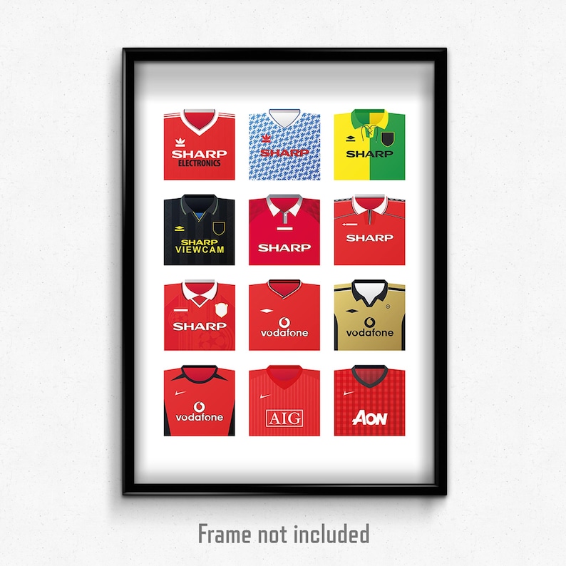 May include: A framed print featuring a grid of twelve vintage soccer jerseys. The jerseys are primarily red, white, and black, with sponsor logos like Sharp, Vodafone, AIG, and AON. The phrase "Frame not included" is at the bottom.