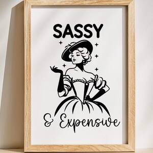 May include: Black and white illustration of a woman in a dress and hat with the text "SASSY & EXPENSIVE".