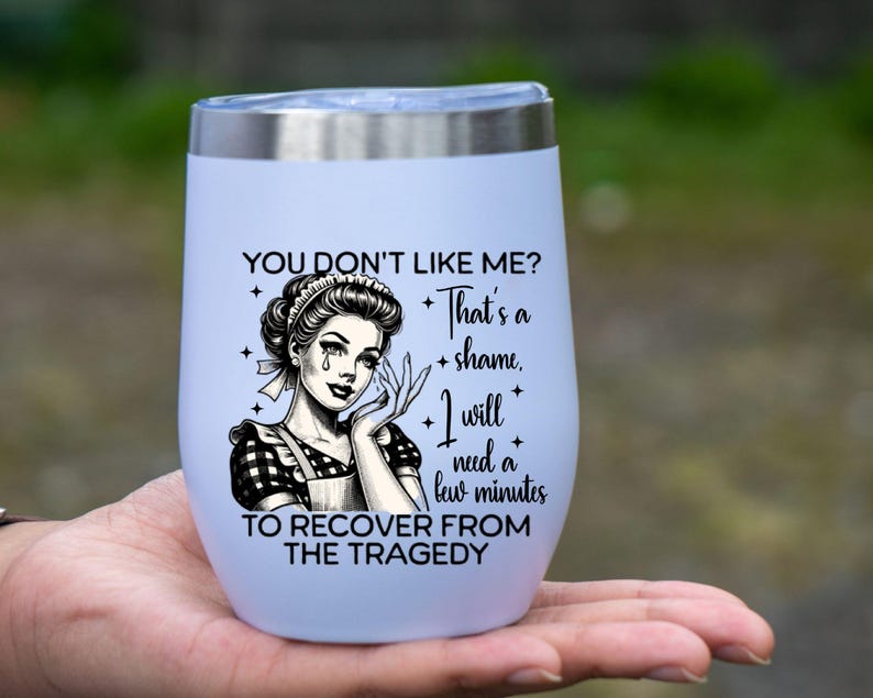 May include: White stainless steel tumbler with a black and white illustration of a woman in a maid's outfit and the text "You don't like me? That's a shame. I will need a few minutes to recover from the tragedy."