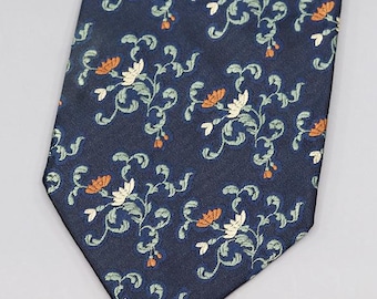 May include: Navy blue necktie with a repeating floral pattern. The design features white and orange flowers with green leaves and stems. The tie is a classic accessory for formal or business attire.
