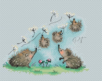 May include: Cross-stitch design featuring five hedgehogs in a whimsical scene. The hedgehogs are brown and gray, with pink accents. They are surrounded by flowers and dandelions on a light blue background. The initials "PT" are in the upper right corner.