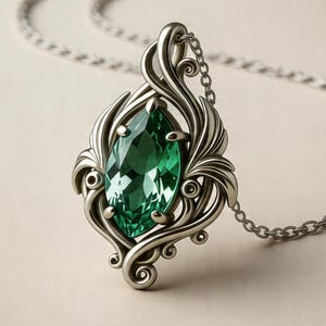 May include: A silver pendant necklace featuring a large, emerald-green gemstone in an ornate, swirling setting. The pendant hangs from a delicate silver chain. The design includes floral and leaf-like details.