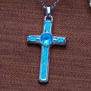 Handmade Natural Stone Cross Necklace with Birthstone, crafted from 925 sterling silver. Sideways cross symbolizes faith and protection, with natural stone resin for healing and personal energy. Available in 14K gold, silver, rose gold, or black plating. Adjustable cable chain (14–22 inch) with lobster clasp. Hypoallergenic and nickel-free. Perfect for baptisms, birthdays, or meaningful spiritual gifts. Gift-ready packaging included.