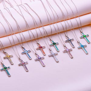 Handmade Natural Stone Cross Necklace with Birthstone, crafted from 925 sterling silver. Sideways cross symbolizes faith and protection, with natural stone resin for healing and personal energy. Available in 14K gold, silver, rose gold, or black plating. Adjustable cable chain (14–22 inch) with lobster clasp. Hypoallergenic and nickel-free. Perfect for baptisms, birthdays, or meaningful spiritual gifts. Gift-ready packaging included.
