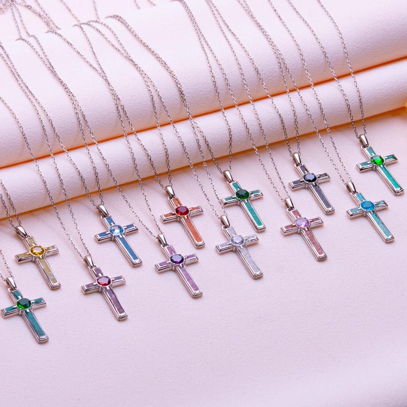 Handmade Natural Stone Cross Necklace with Birthstone, crafted from 925 sterling silver. Sideways cross symbolizes faith and protection, with natural stone resin for healing and personal energy. Available in 14K gold, silver, rose gold, or black plating. Adjustable cable chain (14–22 inch) with lobster clasp. Hypoallergenic and nickel-free. Perfect for baptisms, birthdays, or meaningful spiritual gifts. Gift-ready packaging included.