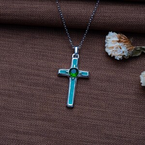 Handmade Natural Stone Cross Necklace with Birthstone, crafted from 925 sterling silver. Sideways cross symbolizes faith and protection, with natural stone resin for healing and personal energy. Available in 14K gold, silver, rose gold, or black plating. Adjustable cable chain (14–22 inch) with lobster clasp. Hypoallergenic and nickel-free. Perfect for baptisms, birthdays, or meaningful spiritual gifts. Gift-ready packaging included.