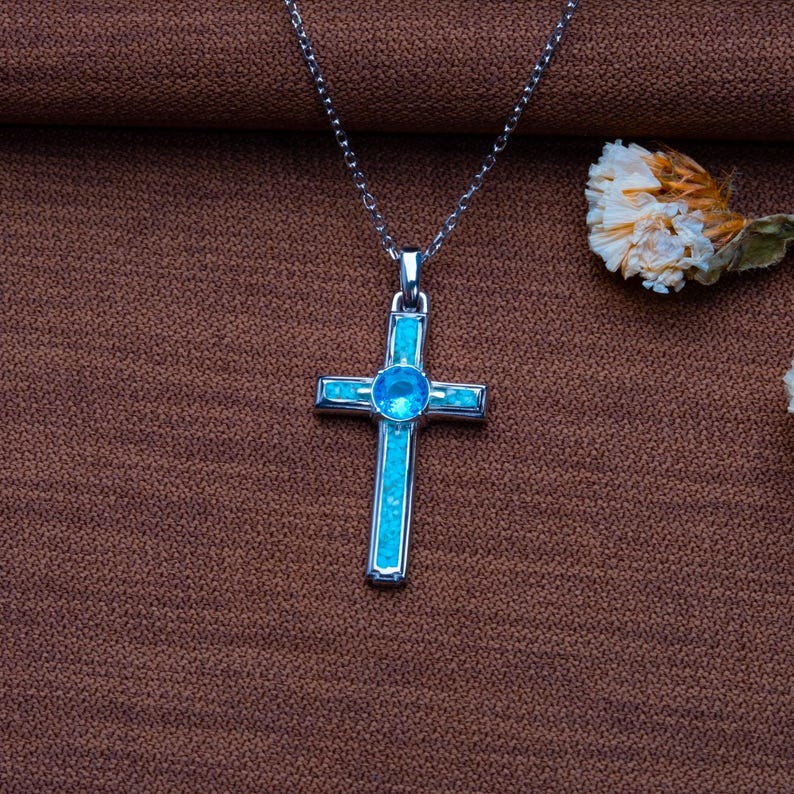 Handmade Natural Stone Cross Necklace with Birthstone, crafted from 925 sterling silver. Sideways cross symbolizes faith and protection, with natural stone resin for healing and personal energy. Available in 14K gold, silver, rose gold, or black plating. Adjustable cable chain (14–22 inch) with lobster clasp. Hypoallergenic and nickel-free. Perfect for baptisms, birthdays, or meaningful spiritual gifts. Gift-ready packaging included.