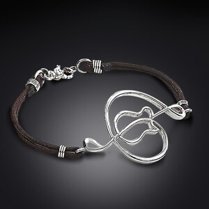 2-inch silver curved guitar bracelet on black leather - guitarclef®