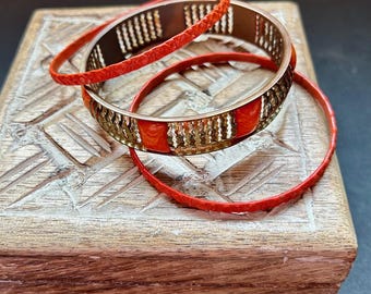 Vintage 3 Piece Orange Enamel and Textured Gold Tone Bangle Bracelet Set