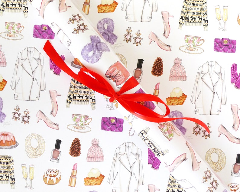 May include: White wrapping paper with a repeating pattern of fashion illustrations, including a white jacket, pink heels, and a purple handbag. A red ribbon is tied around a rolled section of the paper.