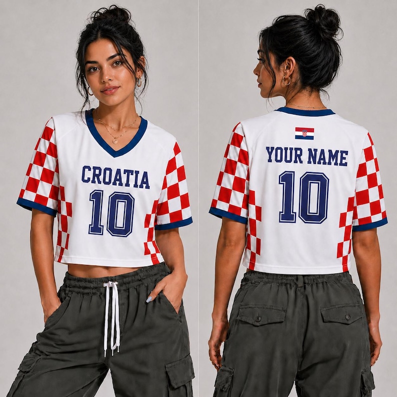 May include: A white V-neck crop top featuring red and white checkered patterns on the sleeves and sides. The front displays the text CROATIA and the number 10 in blue. The back shows the text YOUR NAME, the number 10, and a small Croatian flag.