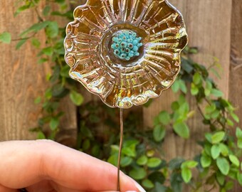 Iridescent golden flameworked glass flower