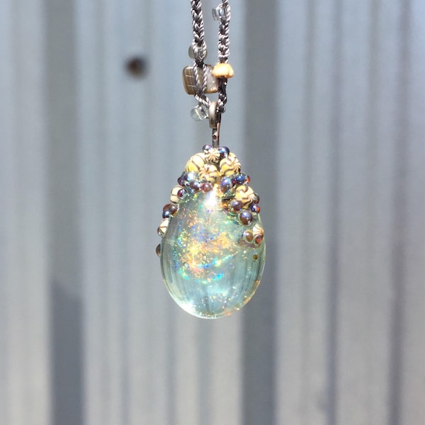 Sparkling barnacle capped flamework aqua pendant