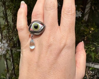 Metallic glass Apotropaic Eye Cocktail Ring with dangling tear