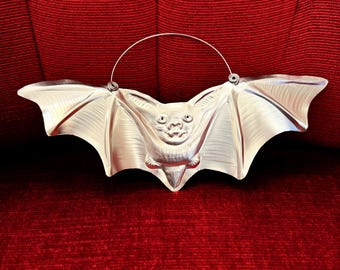 Hand tooled bat ornament