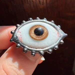 Handmade flamework golden glass eye brooch