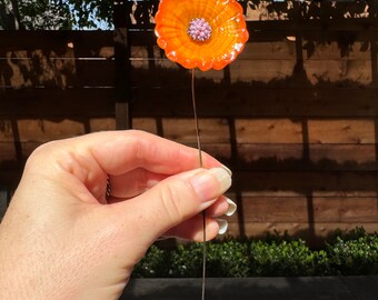 Orange flameworked glass flower