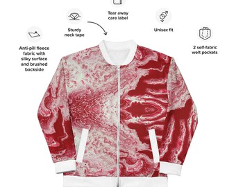 May include: A red and white reversible bomber jacket with a marbled pattern. The jacket has a zipper closure, two welt pockets, and a sturdy neck tape. The care label is tear-away.