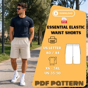 May include: A person wearing a navy blue t-shirt and beige elastic waist shorts. The image includes a PDF pattern graphic with the text "ESSENTIAL ELASTIC WAIST SHORTS", sizes XS-5XL, and US sizes 35-50.