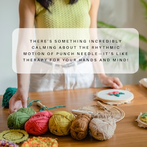 May include: A close-up of a wooden table with a variety of colorful yarn balls, a punch needle, and a finished punch needle project. The text "THERE'S SOMETHING INCREDIBLY CALMING ABOUT THE RHYTHMIC MOTION OF PUNCH NEEDLE - IT'S LIKE THERAPY FOR YOUR HANDS AND MIND!" is visible in the image.